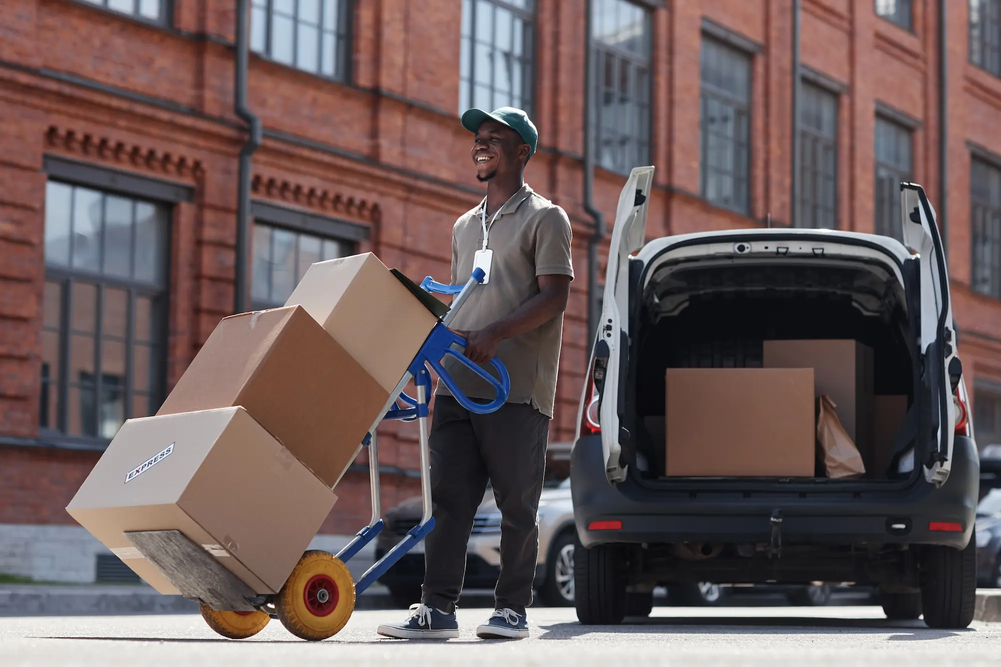delivery man with cart full of boxes 2026 09 21 21 30 54 utc