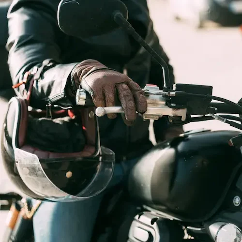 biker-wearing-leather-gloves-is-starting-his-motor-2025-03-15-03-44-28-utc
